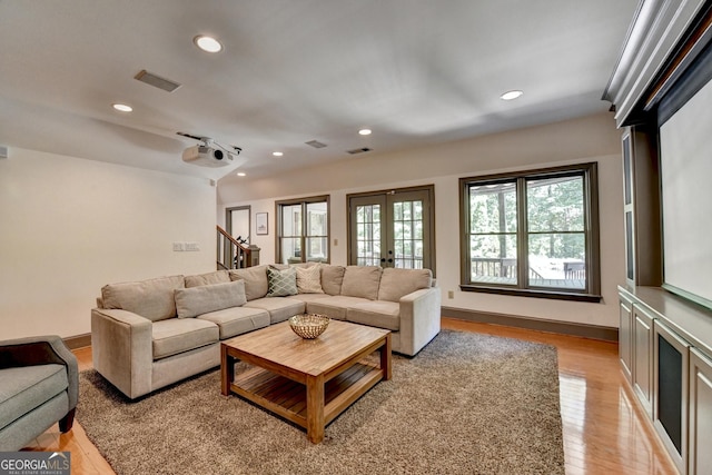 7920 Tintern Trce Unit 298, Duluth, GA 30097 - living area with light wood-style floors, recessed lighting, stairway, french doors, and baseboards