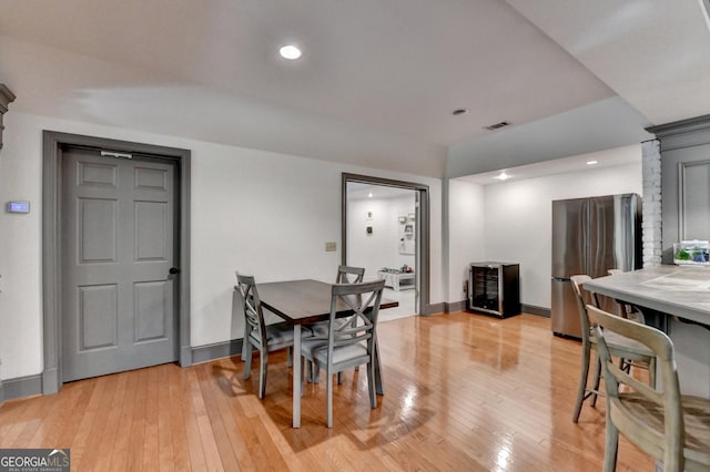 7920 Tintern Trce Unit 298, Duluth, GA 30097 - dining area featuring light wood-type flooring, wine cooler, baseboards, and recessed lighting