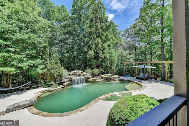 7920 Tintern Trce Unit 298, Duluth, GA 30097 - view of swimming pool featuring a patio area and a pool with connected hot tub