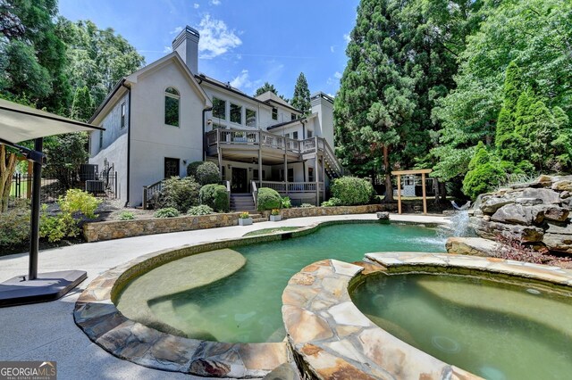 7920 Tintern Trce Unit 298, Duluth, GA 30097 - view of pool featuring stairway, cooling unit, a pool with connected hot tub, and a patio area