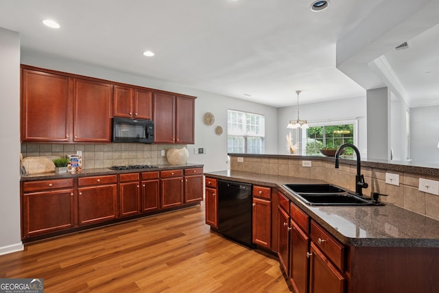 2840 Brookford Ln SW, South Fulton, GA 30331 - kitchen featuring black appliances, a sink, dark brown cabinets, light wood-style flooring, and recessed lighting