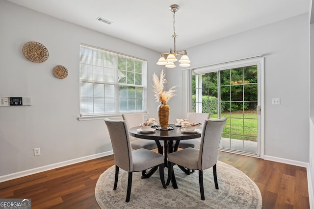 2840 Brookford Ln SW, South Fulton, GA 30331 - dining room with baseboards, healthy amount of natural light, and a chandelier