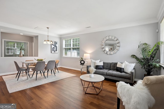 2840 Brookford Ln SW, South Fulton, GA 30331 - living area featuring dark wood-style floors, a chandelier, baseboards, and ornamental molding