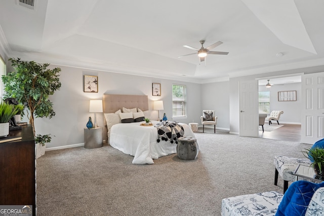 2840 Brookford Ln SW, South Fulton, GA 30331 - bedroom featuring a raised ceiling, carpet, crown molding, baseboards, and a ceiling fan