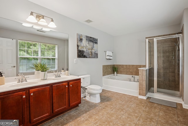 2840 Brookford Ln SW, South Fulton, GA 30331 - full bath with a garden tub, double vanity, a shower stall, toilet, and tile patterned flooring