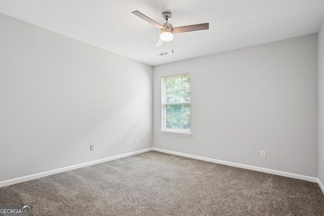 2840 Brookford Ln SW, South Fulton, GA 30331 - spare room featuring carpet floors, baseboards, and a ceiling fan