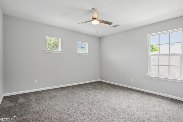2840 Brookford Ln SW, South Fulton, GA 30331 - spare room featuring baseboards, ceiling fan, and carpet flooring