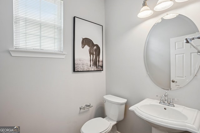 2840 Brookford Ln SW, South Fulton, GA 30331 - half bathroom featuring a sink and toilet