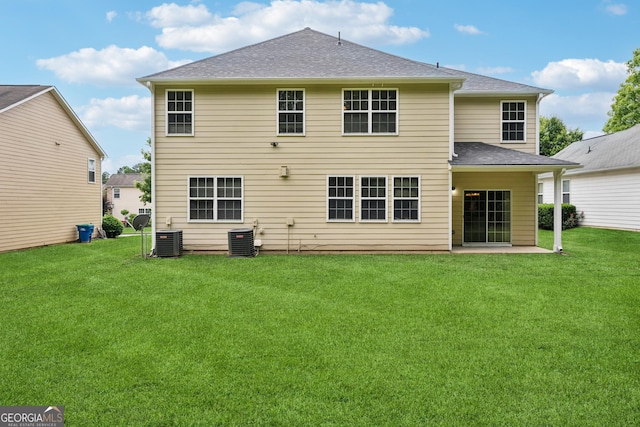2840 Brookford Ln SW, South Fulton, GA 30331 - back of house with central AC, a lawn, and a shingled roof