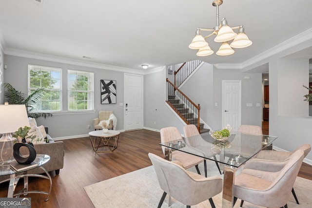 2840 Brookford Ln SW, South Fulton, GA 30331 - dining area with a chandelier, stairs, wood finished floors, ornamental molding, and baseboards