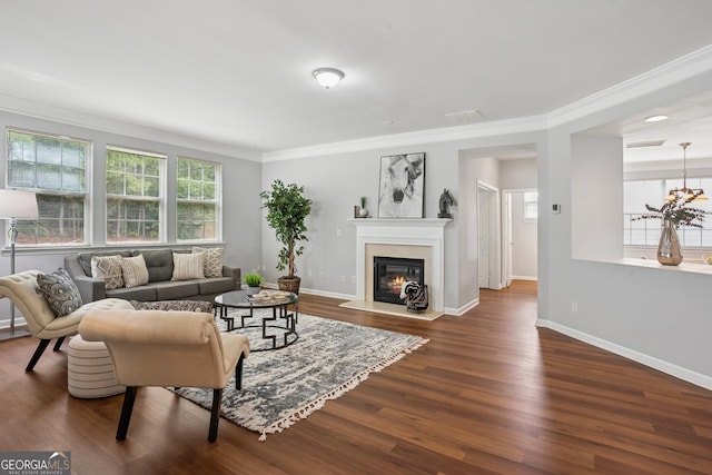 2840 Brookford Ln SW, South Fulton, GA 30331 - living room with dark wood-style floors, crown molding, a glass covered fireplace, and baseboards