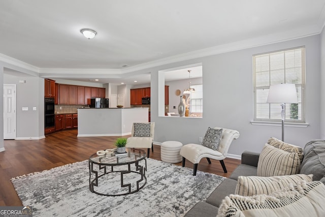 2840 Brookford Ln SW, South Fulton, GA 30331 - living room featuring ornamental molding, dark wood-type flooring, healthy amount of natural light, and baseboards