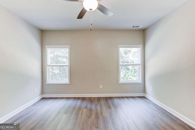 6413 River Plantation Dr, Lula, GA 30554 - unfurnished room with wood finished floors, ceiling fan, and baseboards