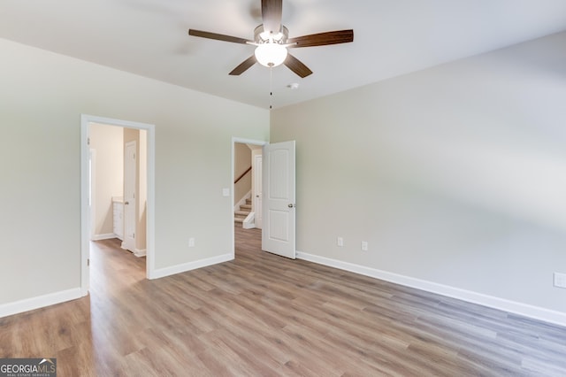 6413 River Plantation Dr, Lula, GA 30554 - unfurnished bedroom with light wood finished floors, baseboards, and ceiling fan