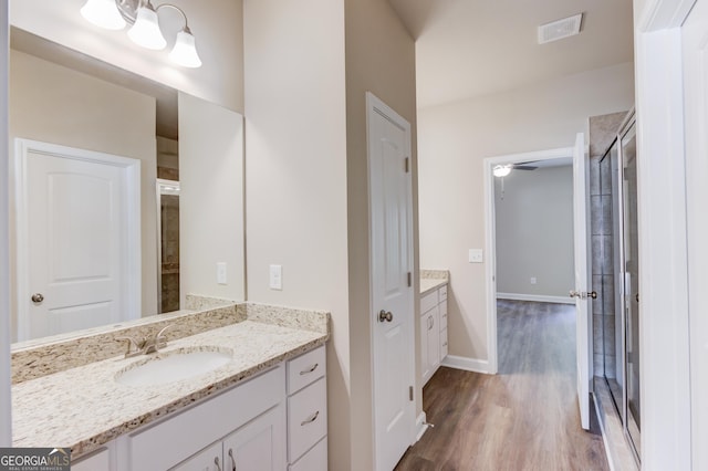 6413 River Plantation Dr, Lula, GA 30554 - full bathroom featuring vanity, wood finished floors, and baseboards