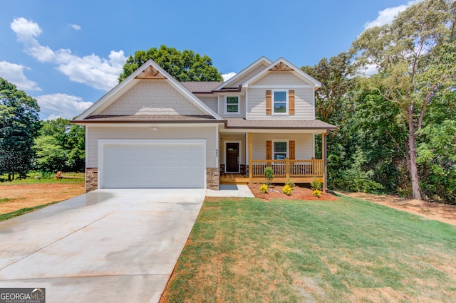 6413 River Plantation Dr, Lula, GA 30554 - craftsman house with covered porch, a garage, driveway, a front yard, and stone siding