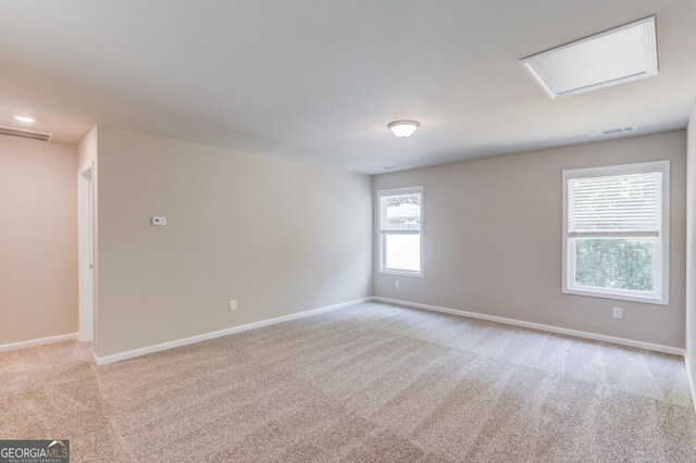 6413 River Plantation Dr, Lula, GA 30554 - empty room featuring attic access, light carpet, and baseboards
