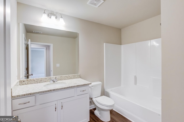 6413 River Plantation Dr, Lula, GA 30554 - bathroom featuring toilet, wood finished floors, vanity, and bathtub / shower combination
