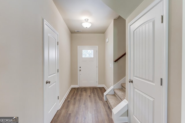 6413 River Plantation Dr, Lula, GA 30554 - foyer featuring wood finished floors, stairs, and baseboards