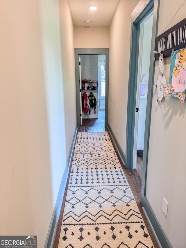 2980 Hd Atha Rd, Covington, GA 30014 - hall featuring dark wood finished floors and baseboards