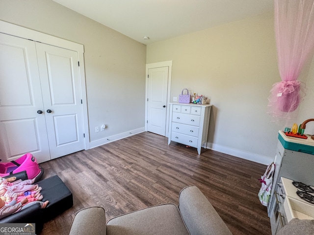2980 Hd Atha Rd, Covington, GA 30014 - bedroom featuring baseboards, wood finished floors, and a closet