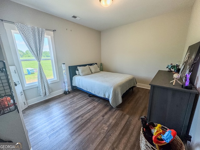 2980 Hd Atha Rd, Covington, GA 30014 - bedroom featuring dark wood-type flooring and baseboards