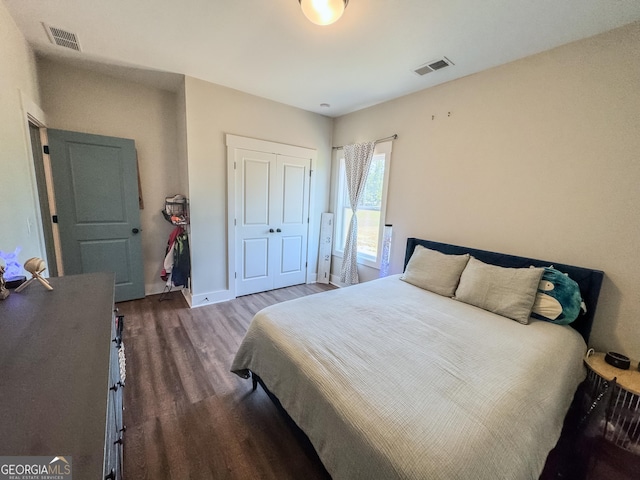 2980 Hd Atha Rd, Covington, GA 30014 - bedroom with wood finished floors, a closet, and baseboards