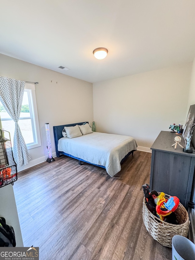 2980 Hd Atha Rd, Covington, GA 30014 - bedroom featuring dark wood-type flooring and baseboards