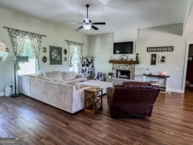 2980 Hd Atha Rd, Covington, GA 30014 - living room featuring dark wood-style floors, ceiling fan, a fireplace, and healthy amount of natural light