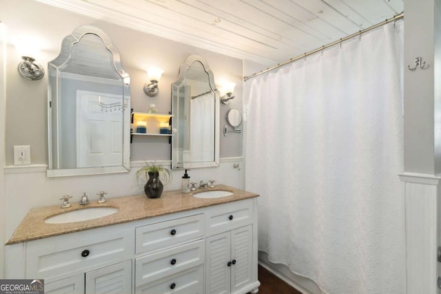 6551 Bermuda Ln, Flowery Branch, GA 30542 - full bathroom featuring double vanity, crown molding, and a shower with shower curtain