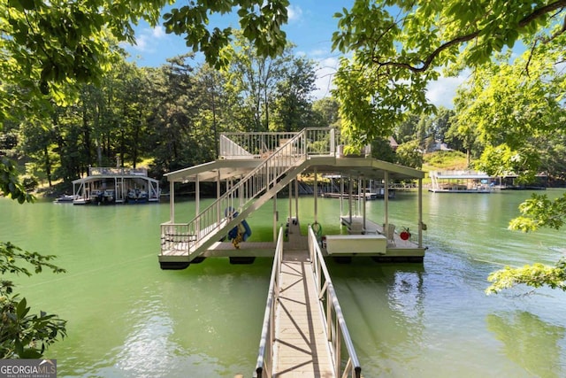 6551 Bermuda Ln, Flowery Branch, GA 30542 - dock area with a water view and view of wooded area