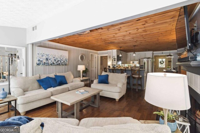6551 Bermuda Ln, Flowery Branch, GA 30542 - living room with wooden ceiling and dark wood-style floors