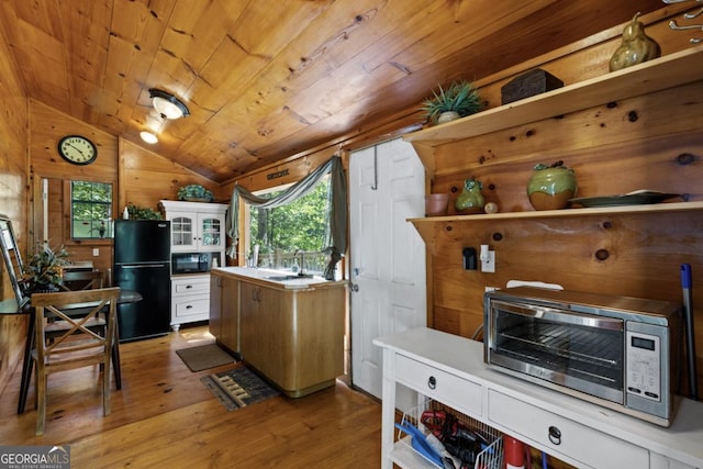 382 Highland Rd, Ellijay, GA 30540 - kitchen with black appliances, vaulted ceiling, wooden ceiling, wood finished floors, and a sink