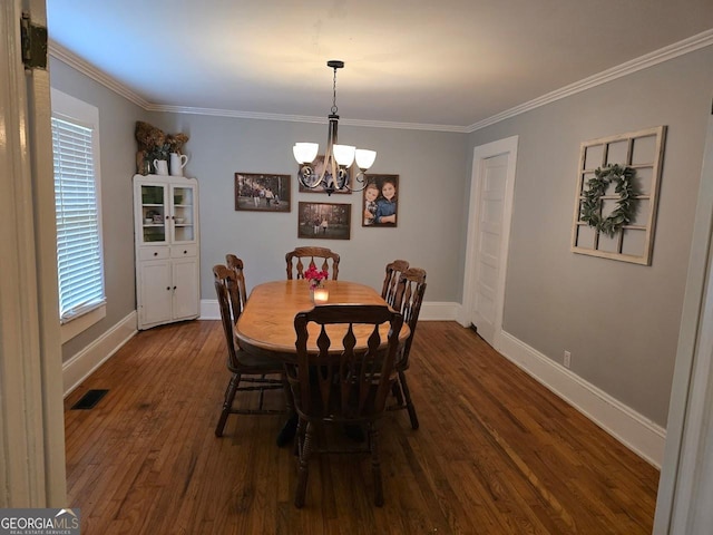 142 Griffin Dr, Carrollton, GA 30117 - dining area with a chandelier, dark wood finished floors, and ornamental molding