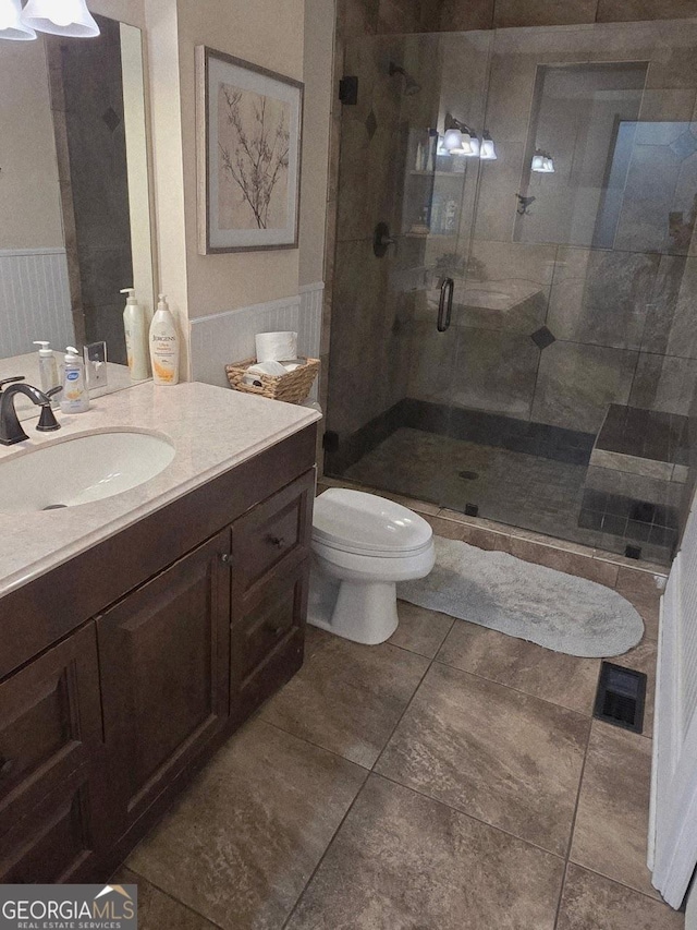 142 Griffin Dr, Carrollton, GA 30117 - full bath with a stall shower, vanity, tile patterned flooring, and wainscoting