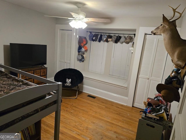142 Griffin Dr, Carrollton, GA 30117 - bedroom with light wood finished floors and a ceiling fan