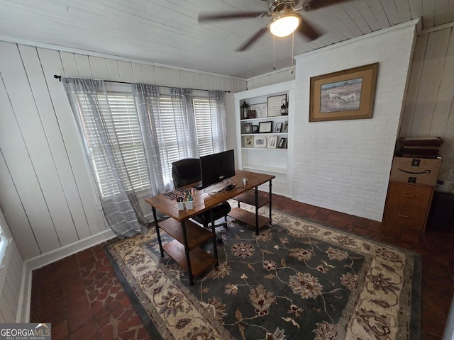 142 Griffin Dr, Carrollton, GA 30117 - office with brick floors, ceiling fan, wooden walls, and built in shelves