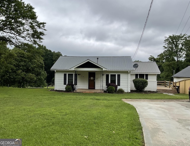 574 Lakeview Dr, Gainesville, GA 30501 - view of front of property with covered porch, a front lawn, and a metal roof