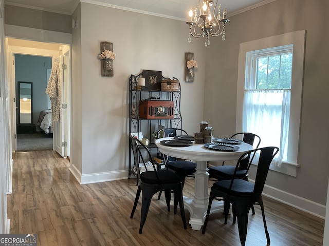 574 Lakeview Dr, Gainesville, GA 30501 - dining space with wood finished floors, a chandelier, baseboards, and crown molding