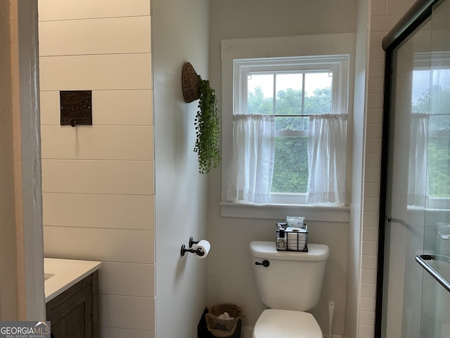 574 Lakeview Dr, Gainesville, GA 30501 - bathroom featuring toilet, healthy amount of natural light, vanity, and a stall shower