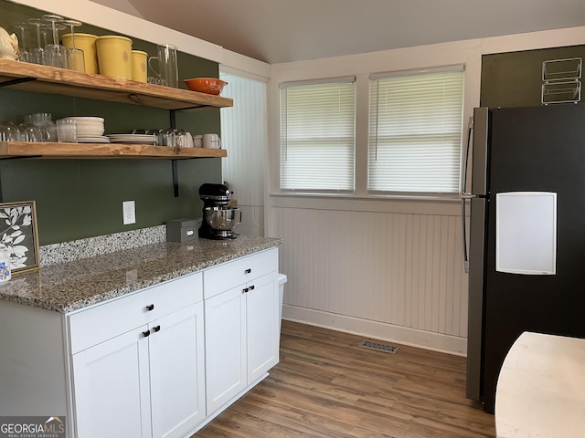 574 Lakeview Dr, Gainesville, GA 30501 - kitchen with freestanding refrigerator, open shelves, white cabinetry, wood finished floors, and light stone countertops