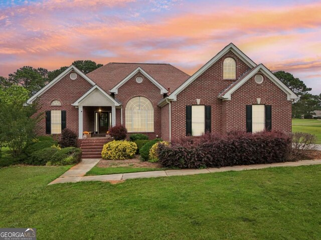 1535 Lake Dow Rd, Mcdonough, GA 30252 - view of front facade featuring brick siding and a front yard