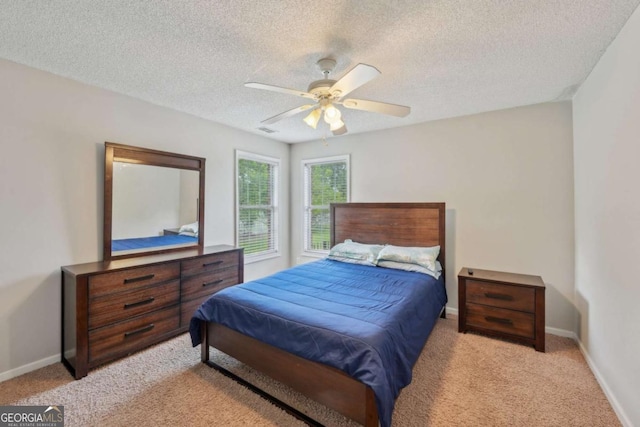 1535 Lake Dow Rd, Mcdonough, GA 30252 - bedroom featuring light colored carpet, a textured ceiling, and ceiling fan