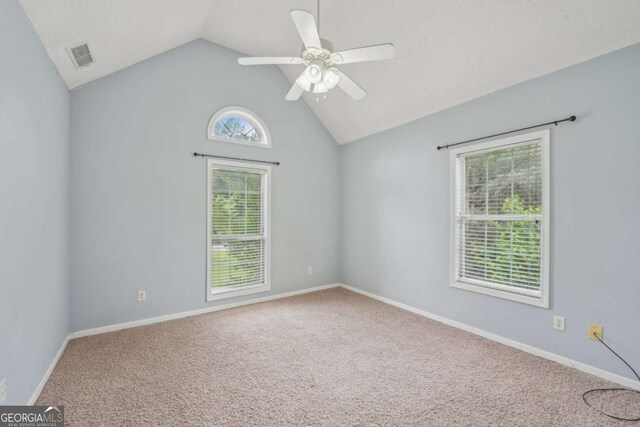 1535 Lake Dow Rd, Mcdonough, GA 30252 - carpeted empty room featuring vaulted ceiling and ceiling fan