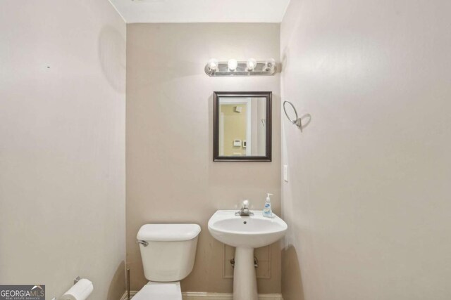 1535 Lake Dow Rd, Mcdonough, GA 30252 - half bathroom featuring toilet