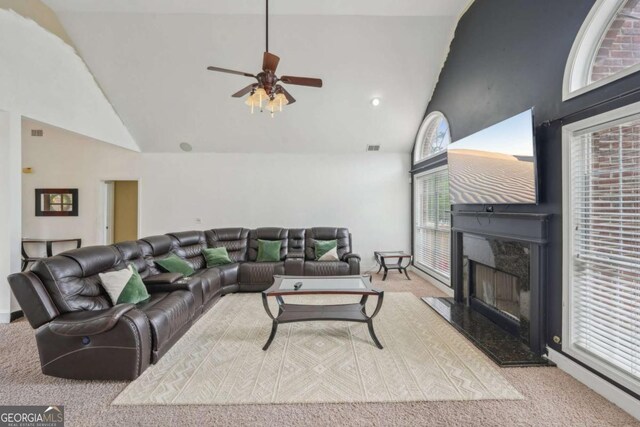 1535 Lake Dow Rd, Mcdonough, GA 30252 - living area with high vaulted ceiling, carpet flooring, a premium fireplace, and a ceiling fan