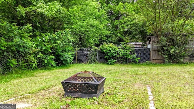 717 Morningside Dr, Dalton, GA 30721 - view of yard featuring an outdoor fire pit