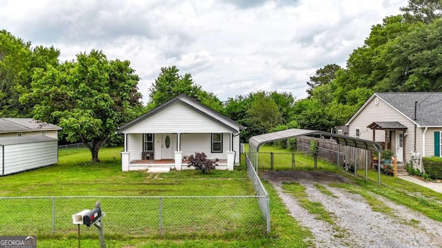 717 Morningside Dr, Dalton, GA 30721 - view of front of home with driveway, a detached carport, a porch, and an outbuilding