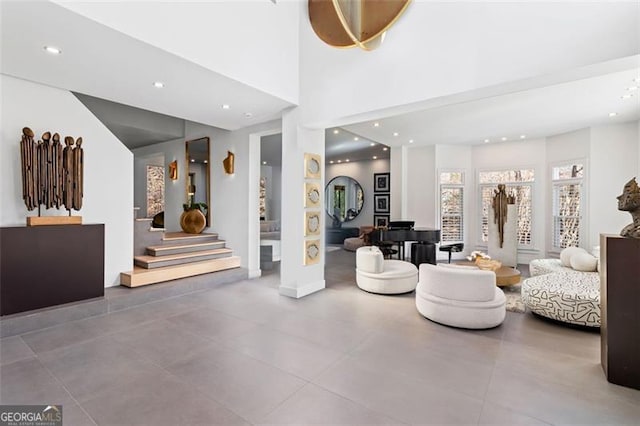 8610 Sentinae Chase Dr, Roswell, GA 30076 - living room with stairs, recessed lighting, and a towering ceiling