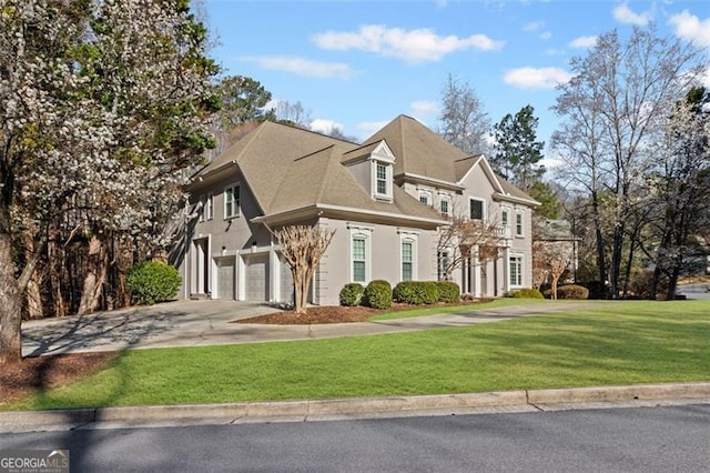 8610 Sentinae Chase Dr, Roswell, GA 30076 - view of front facade with concrete driveway, a garage, a front yard, and stucco siding